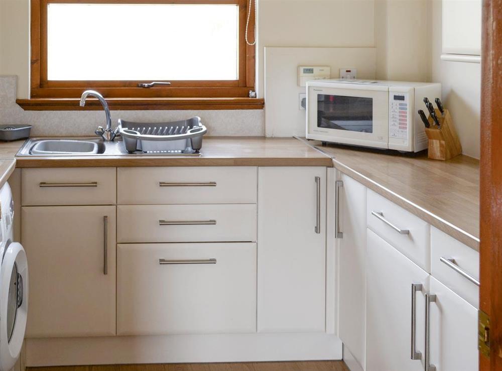 Well-equipped fitted kitchen at Lochinchard Cottage in Kinlochbervie, Sutherland, Great Britain