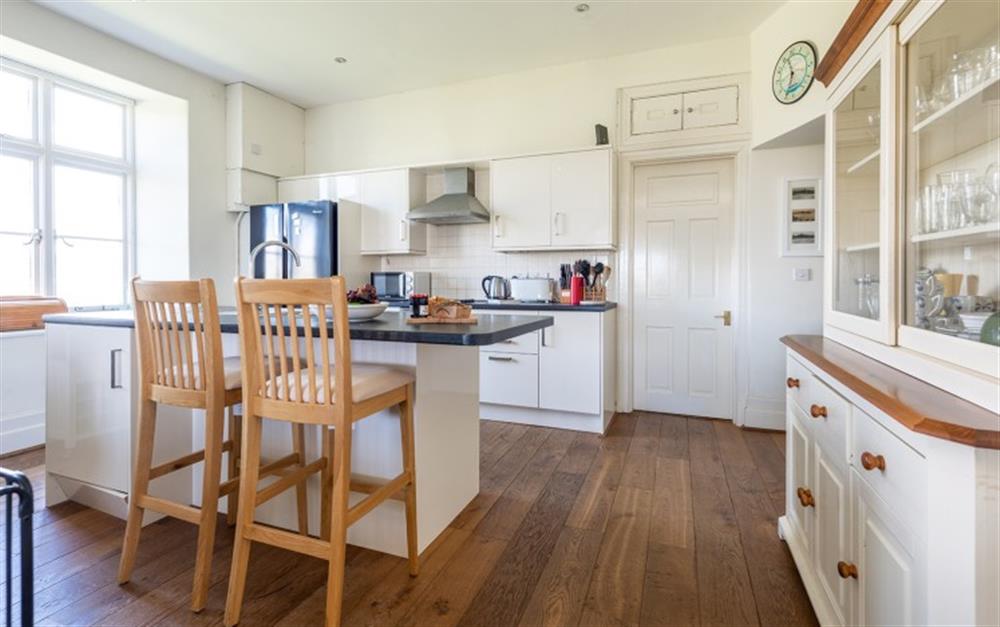 The kitchen with breakfast bar  at Lockslea House in Thurlestone