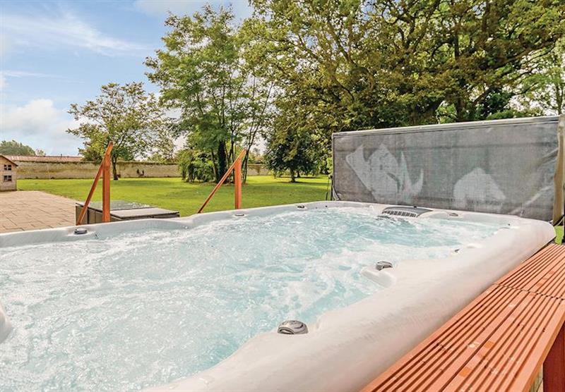 Hot tub at Lode Hall Cottages in Three Holes, Cambridge