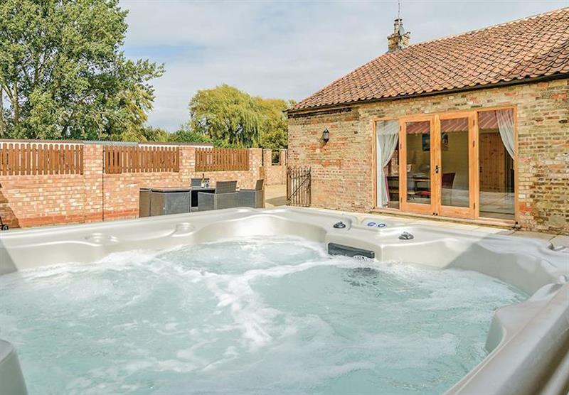The Coach House hot tub at Lode Hall Cottages in Three Holes, Cambridge
