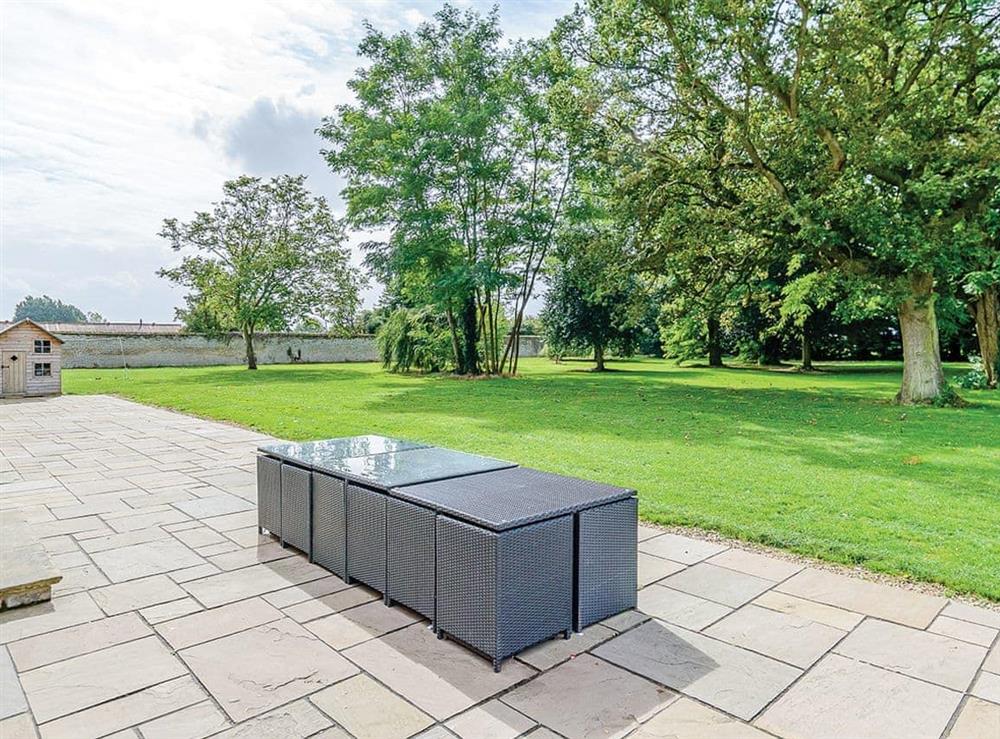 Outdoor furniture on the patio at Lode Hall in Three Holes, near Downham Market, Norfolk