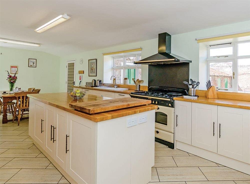 Well-equipped kitchen with dining area at Lode Hall in Three Holes, near Downham Market, Norfolk