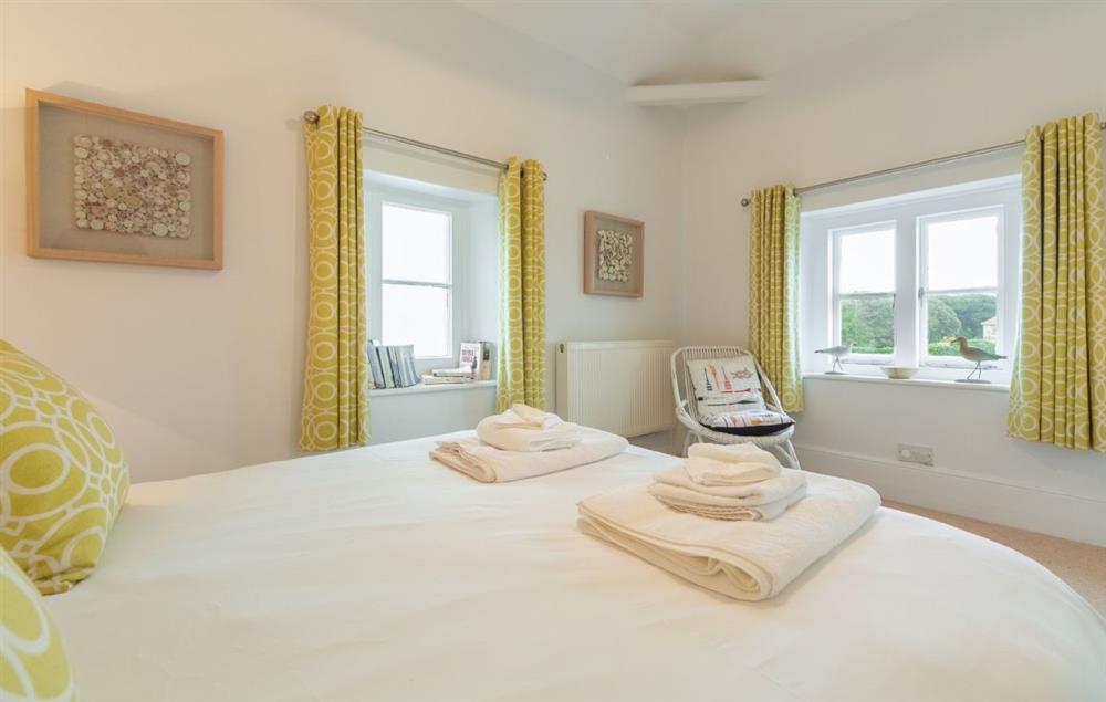 Bedroom with 5’ king-size bed (photo 3) at Lodesman Cottage, North Foreland Lighthouse
