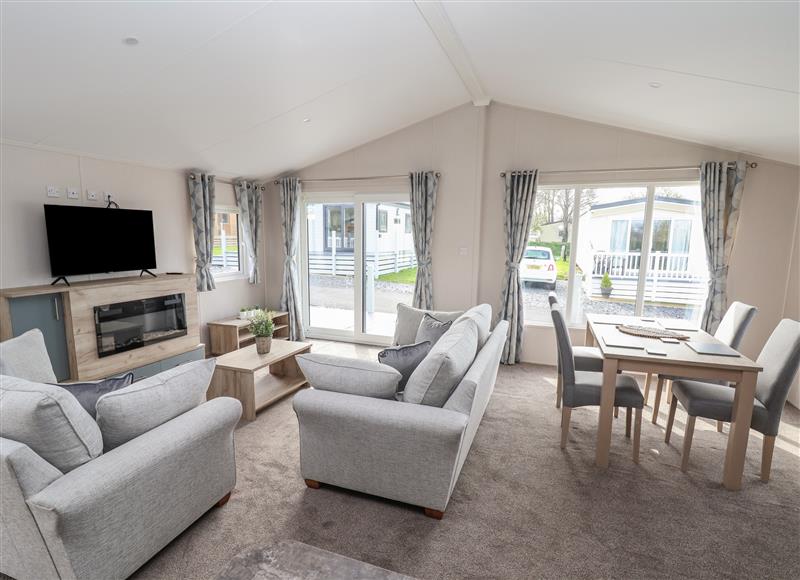 Relax in the living area at Lodge 3, St Asaph