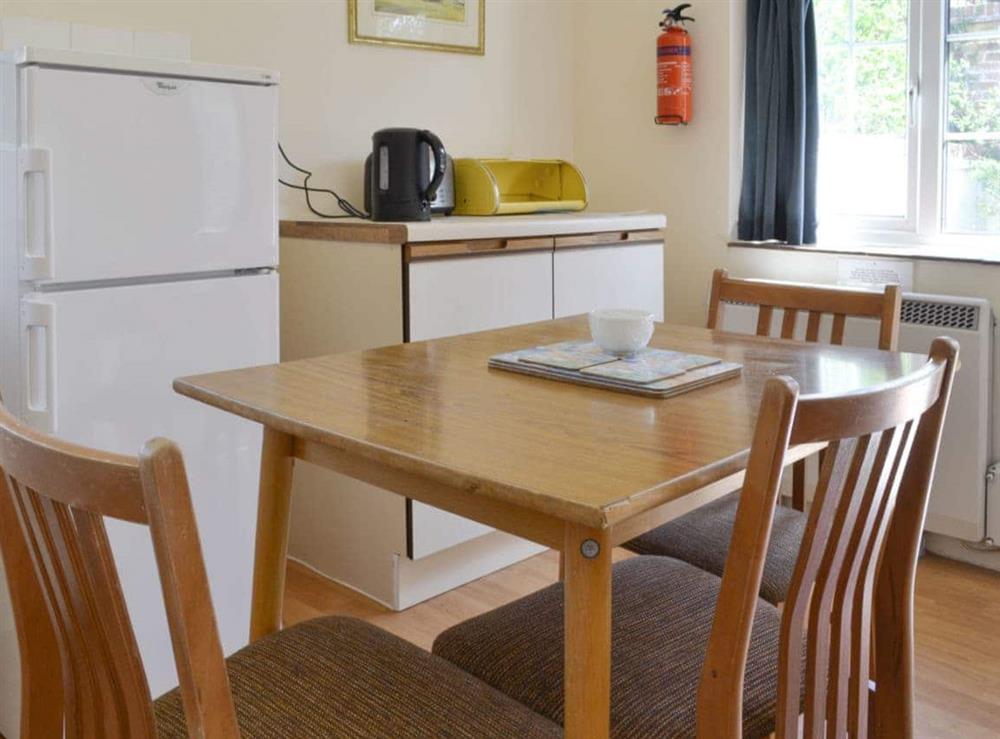 Convenient dining area within kitchen space at Lodge Cottage in Scarning, near Dereham, Norfolk