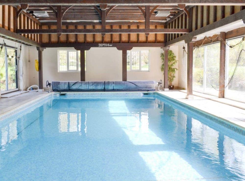 Large shared indoor heated swimming pool at Lodge Cottage in Scarning, near Dereham, Norfolk