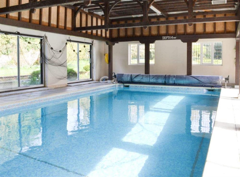 Shared indoor heated swimming pool at Lodge Cottage in Scarning, near Dereham, Norfolk