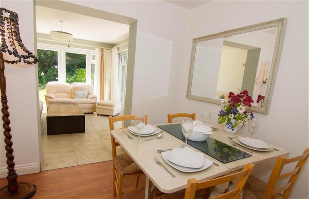 Ground floor:  Dining area with table with seating for four at Lodge End, Heacham near Kings Lynn