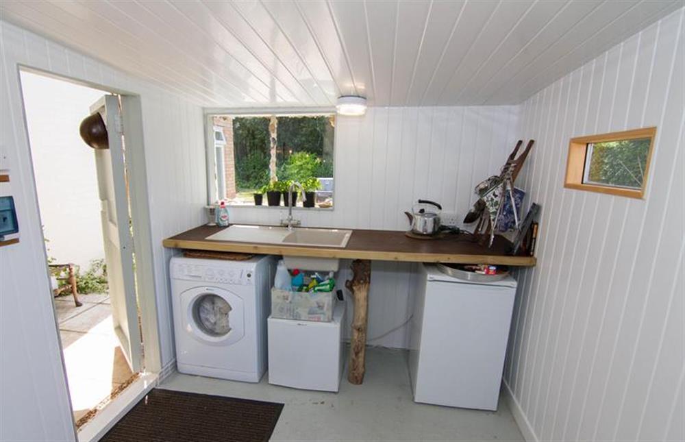 Ground floor:  Utility/garden room with washing machine and freezer at Lodge End, Heacham near Kings Lynn