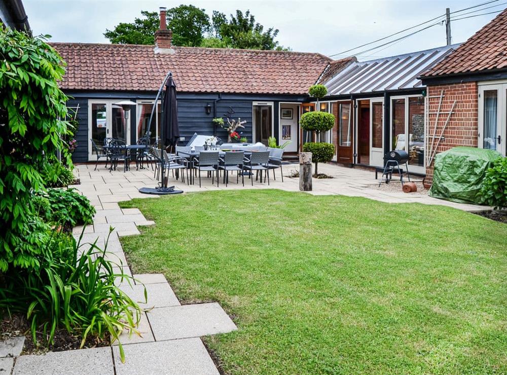You will spend a lot of time in this courtyard in the summer months, enjoying the weather and relaxing. at Lodge Farm Barn in South Walsham, North Norfolk, England