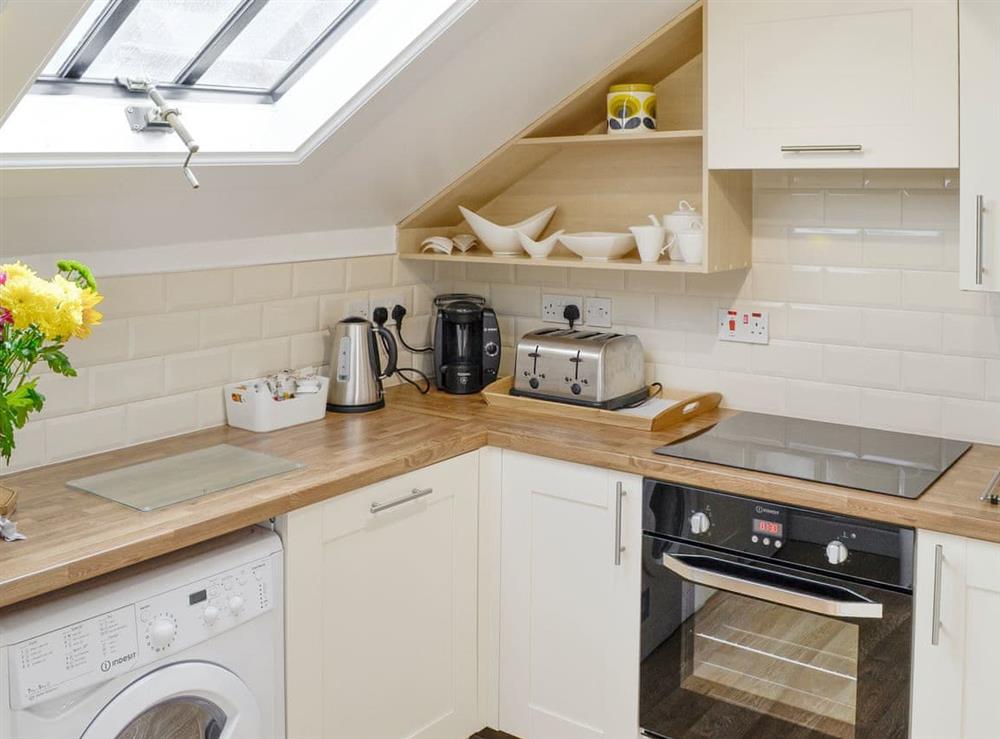 Well-equipped fitted kitchen at Loft 10 in Keswick, Cumbria, England