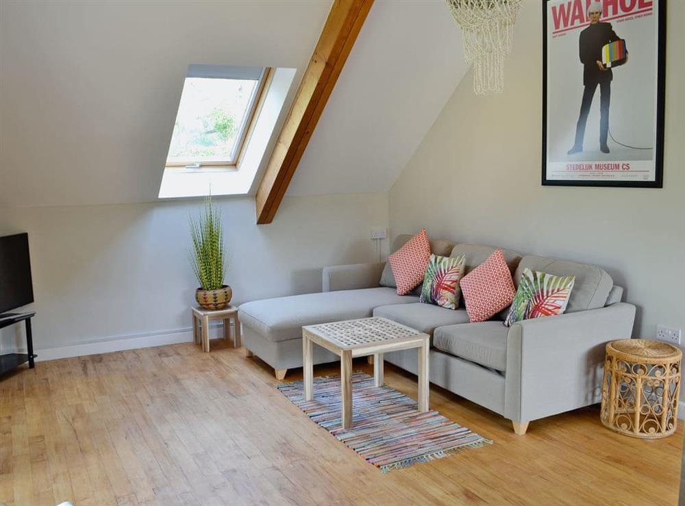 Stylishly furnished living area at Loft by the Pond in Uploders, near Bridport, Dorset
