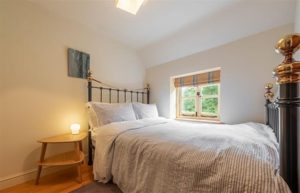 First floor: Bedroom two with a double bed at Loke Cottage, Bessingham near Norwich