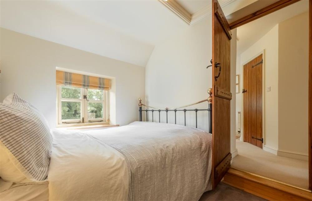 First floor: Bedroom two at Loke Cottage, Bessingham near Norwich