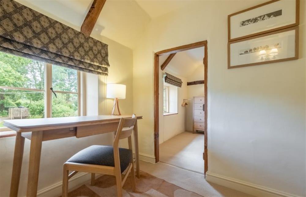First floor: Landing with office desk and door to the master bedroom at Loke Cottage, Bessingham near Norwich