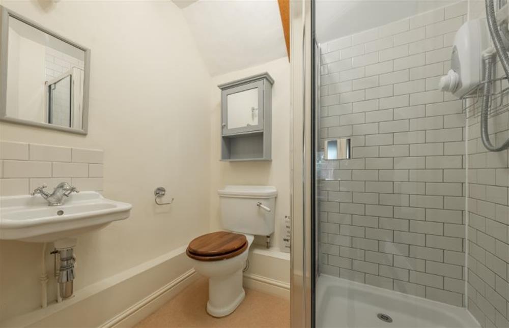 First floor: Shower room with shower, WC and wash basin at Loke Cottage, Bessingham near Norwich
