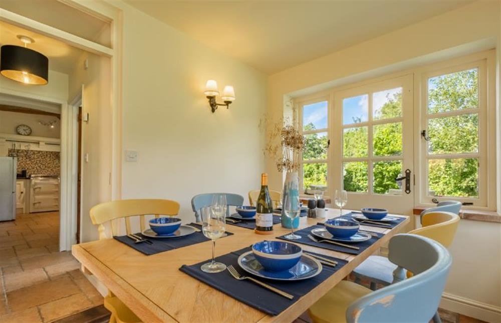 Ground floor: Dining room with door to kitchen at Loke Cottage, Bessingham near Norwich