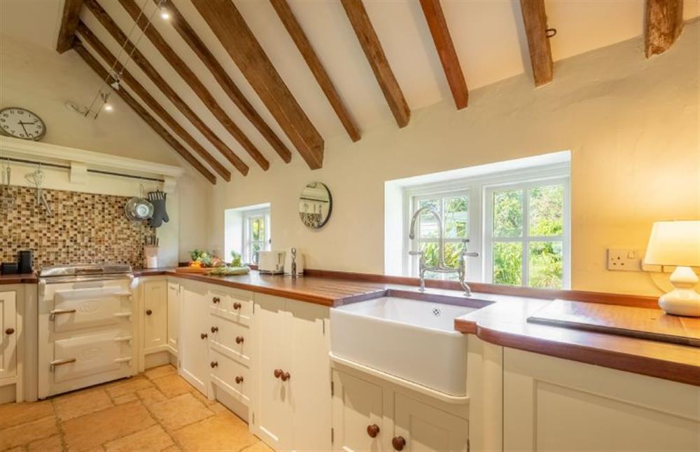 Ground floor: Well-equipped kitchen with original timber beams, electric Evershot oven and hob, Butlerfts sink, microwave, dishwasher, fridge-freezer and washing machine/ tumble dryer