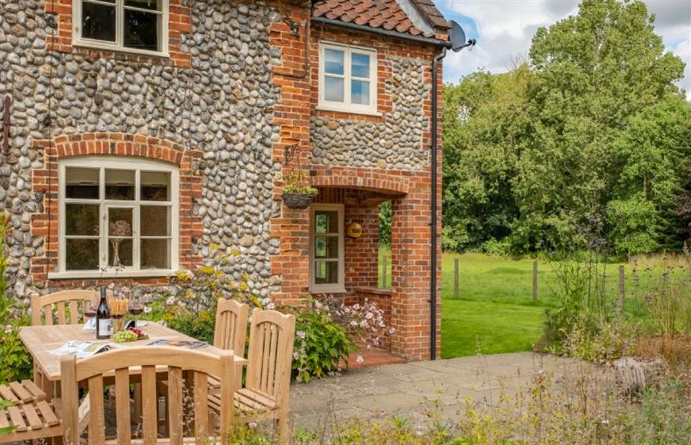 Loke Cottage is surrounded by gardens at Loke Cottage, Bessingham near Norwich