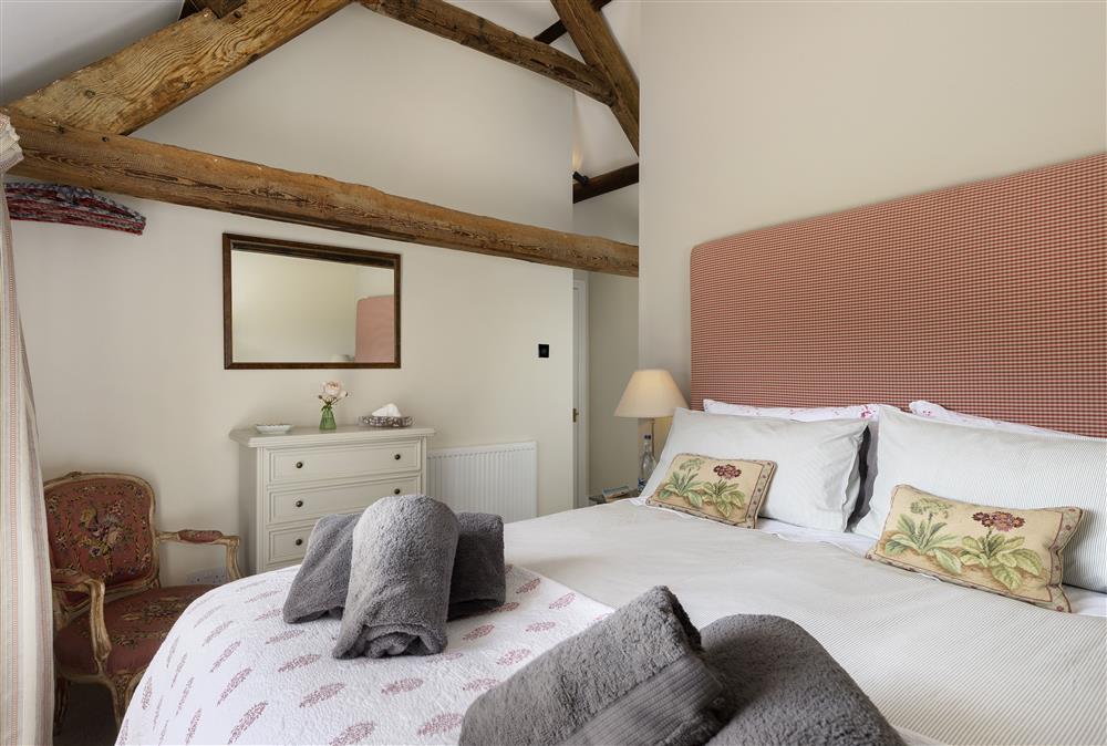 Ground floor: Master bedroom with 5ft king-size bed and en-suite shower room at Long Barn, near Cirencester