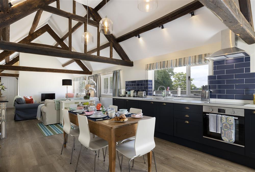Ground floor: Open-plan living area with beautiful exposed beams at Long Barn, near Cirencester