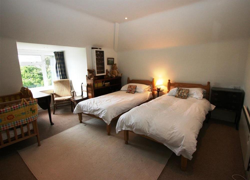 Comfortably furnished twin bedroom at Long Cove in Porthcothan