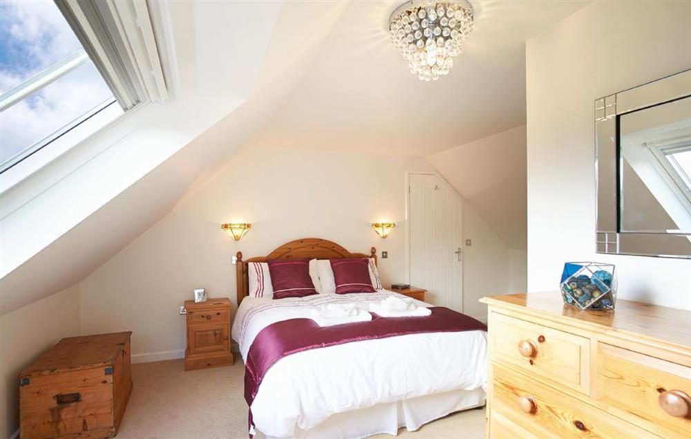 Double bedroom with 5’ bed and en-suite shower room at Long Meadow Barn, Down St Mary