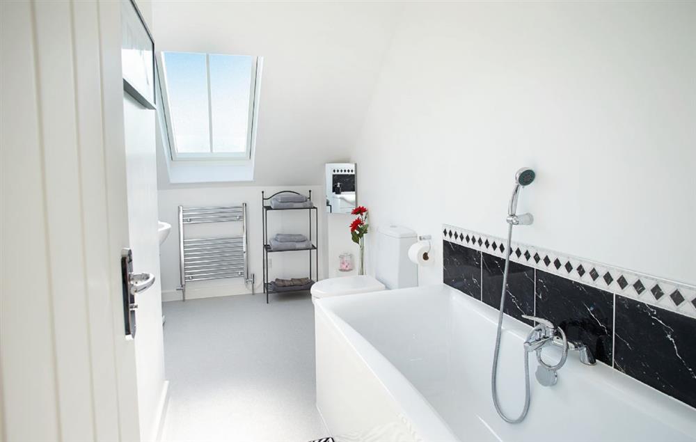 Family bathroom with bath and hand shower attachment at Long Meadow Barn, Down St Mary