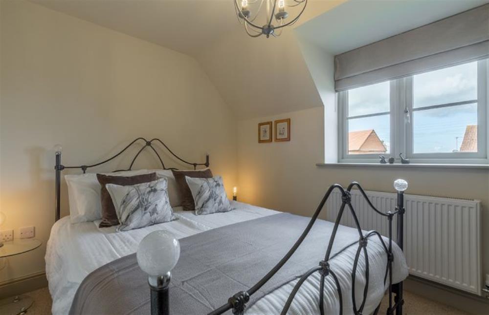 First floor: Bedroom three, king-size bed at Long Meadow, Great Bircham near Kings Lynn