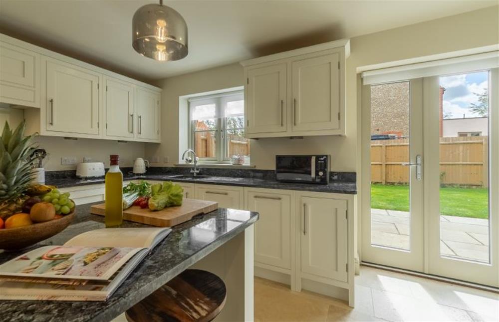 The kitchen opens out into the garden at Long Meadow, Great Bircham near Kings Lynn