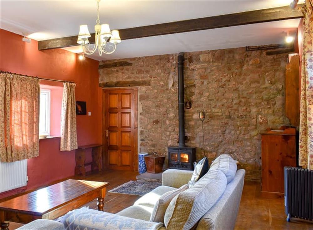 Spacious living room with cosy wood burner at Longfellow in Goodrich, near Ross-on-Wye , Herefordshire