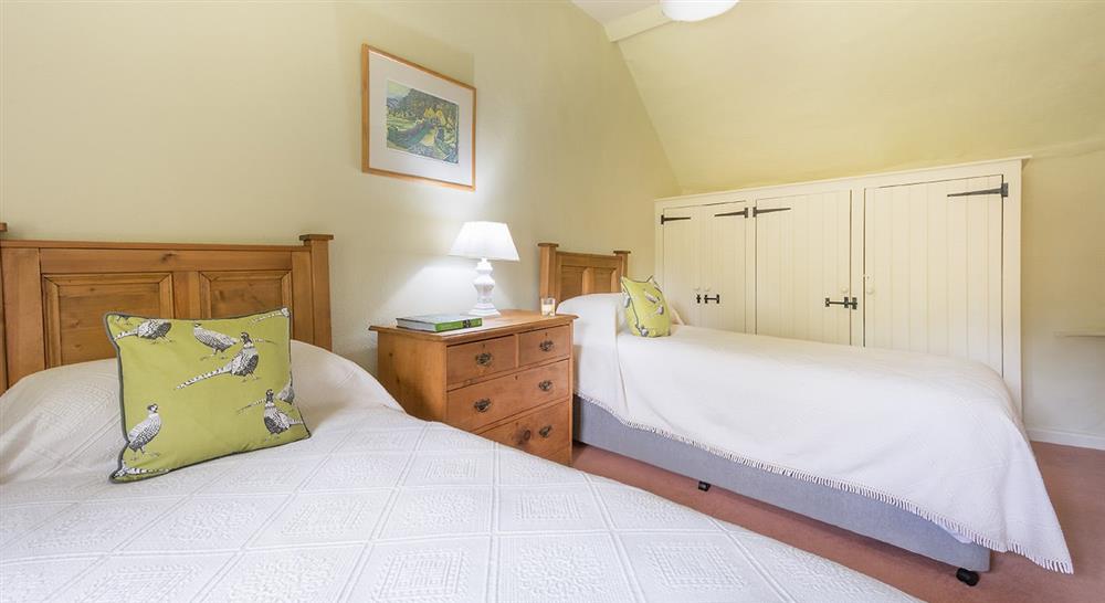 The twin bedroom at Longmeadow Cottage in Exeter, Devon
