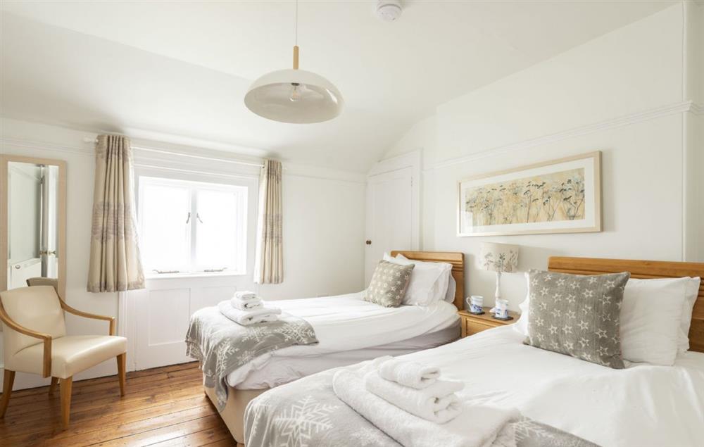 Bedroom with twin 3’ single beds and sea views at Longships, The Lizard