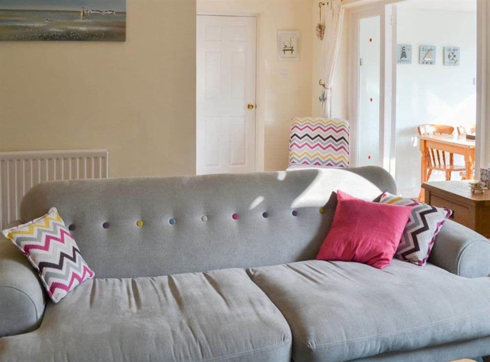 Comfortable sofas in the living room at Longstone Bungalow in Beadnell, Northumberland