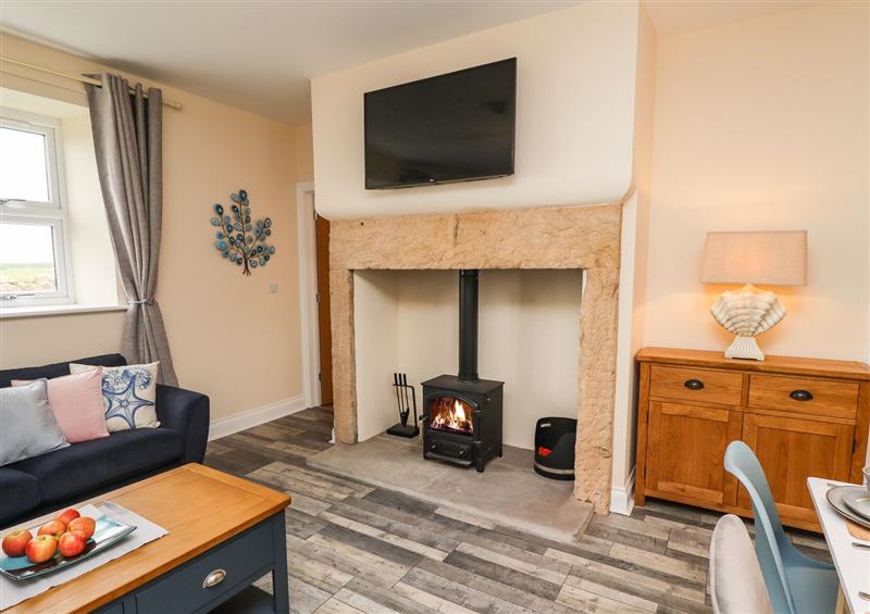 Relax in the living area at Lonnon Cottage, Lesbury near Alnmouth