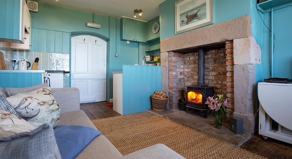 The sitting area and kitchen (photo 2) at Lookout Cottage in Alnwick, Northumberland