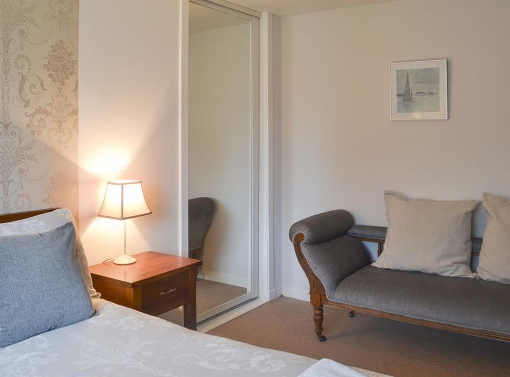 Double bedroom with additional seating at Loramore in Aviemore, Highlands, Inverness-Shire