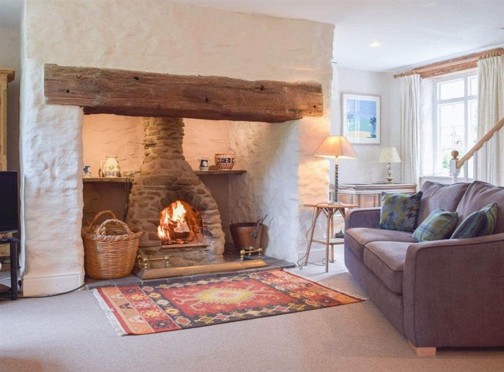 Beautiful living room with Inglenook fireplace at Lordship Farmhouse in Wolfscastle, near Haverfordwest, Dyfed