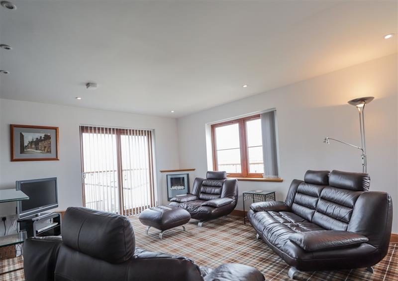 Enjoy the living room at Lossiemouth Bay Cottage, Lossiemouth