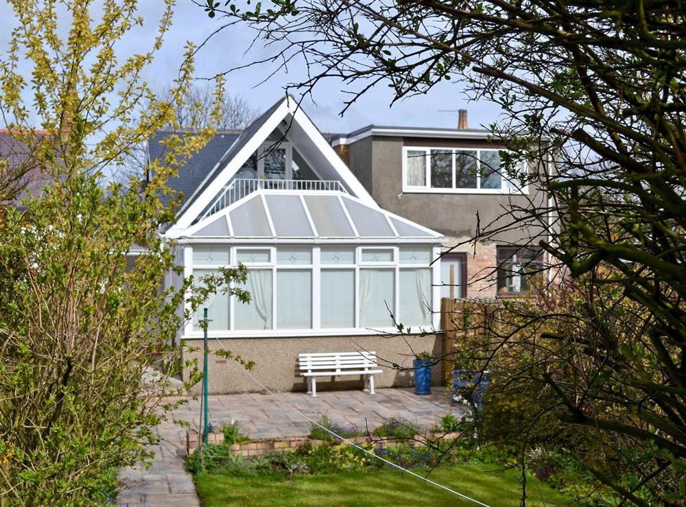 Exterior of the rear with conservatory at Lotties Place in Seahouses, Northumberland