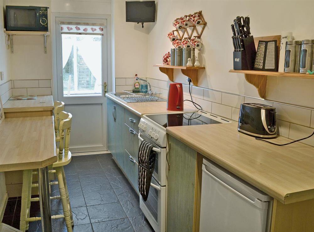 Well equipped galley-style kitchen at Lotties Place in Seahouses, Northumberland