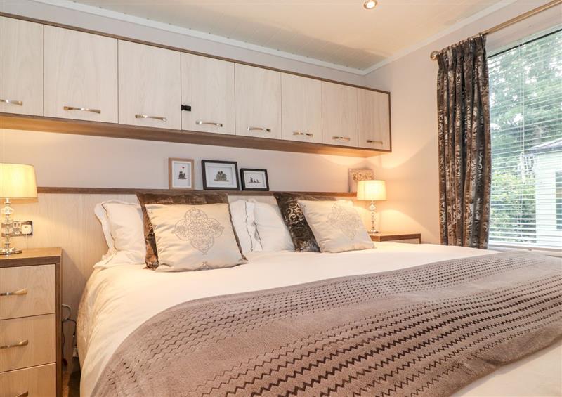 This is a bedroom at Loubis Lakeside Lodge, Fallbarrow Park near Bowness-On-Windermere