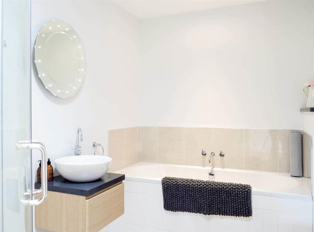 Family bathroom with bath and separate shower cubicle at Lovells Barn in Welland, near Malvern, Worcestershire