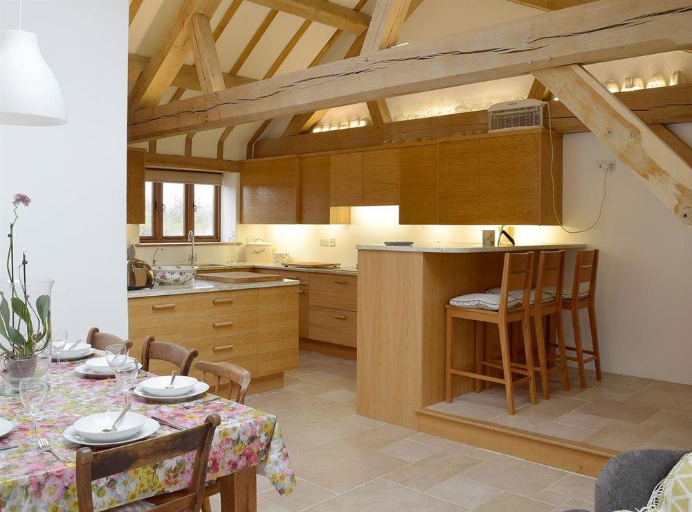 Well equipped kitchen with breakfast area at Low Farm Barn in Laxfield, Suffolk