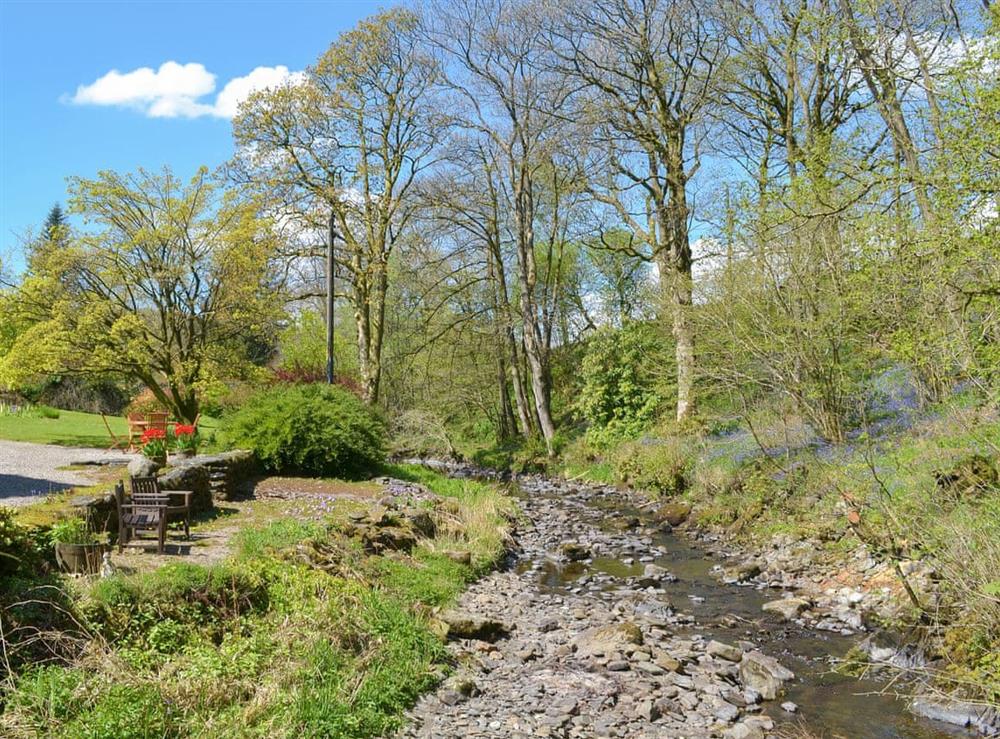 Shared gardens next to the banks of Bannisdale Beck at Low Jock Scar Country Estate in Kendal, Cumbria
