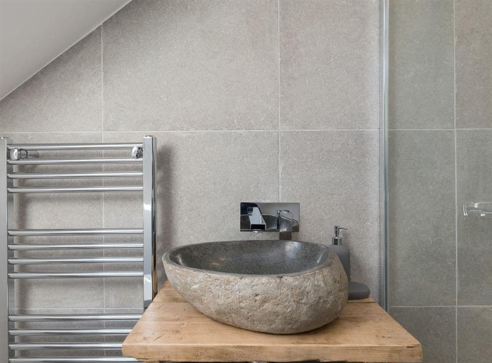 Contemporary fixtures and fittings in the en-suite bathroom at Low Pasture Cottage in Hudswell, near Richmond, North Yorkshire