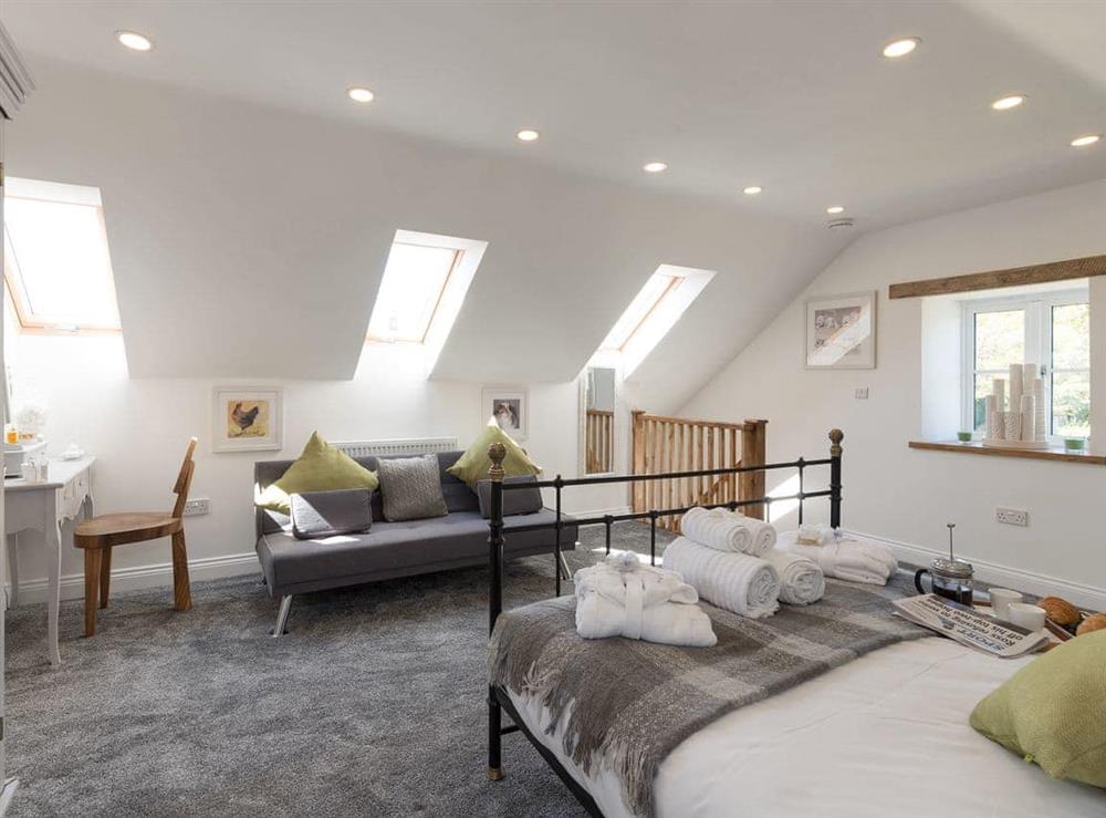 Light and airy bedroom with sloping ceilings at Low Pasture Cottage in Hudswell, near Richmond, North Yorkshire