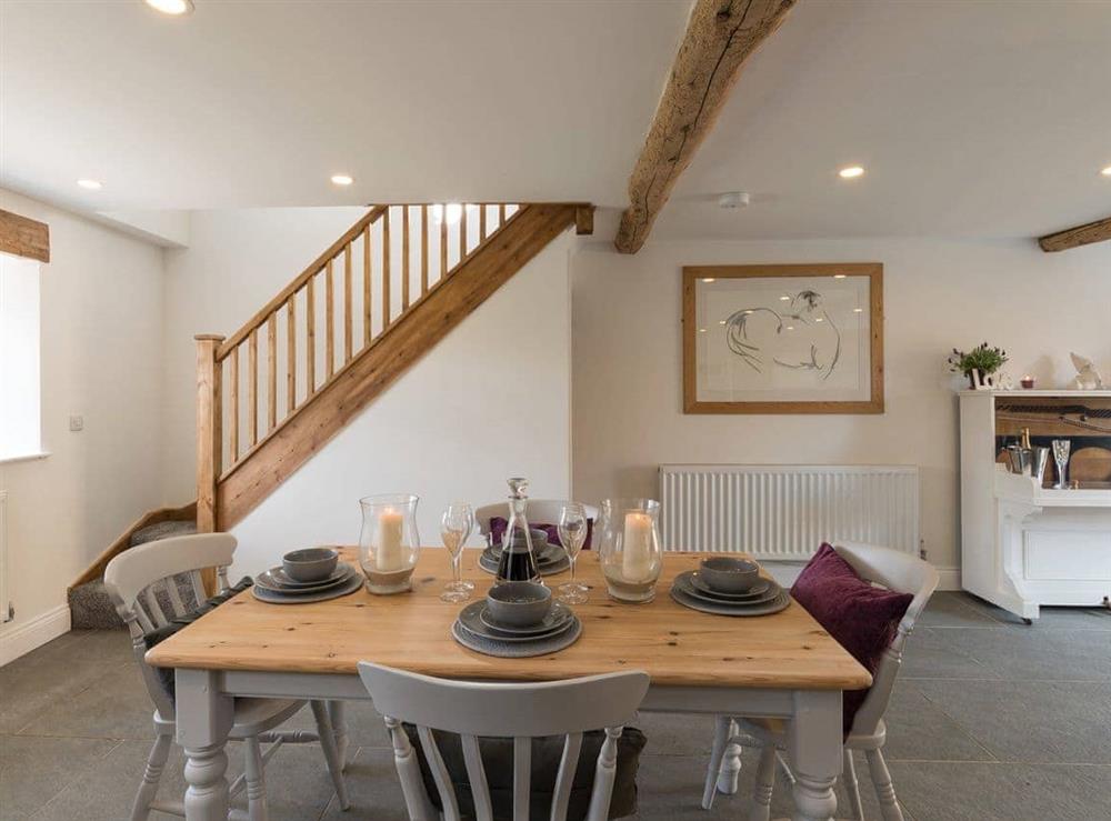 Traditional farmhouse style dining table and chairs at Low Pasture Cottage in Hudswell, near Richmond, North Yorkshire