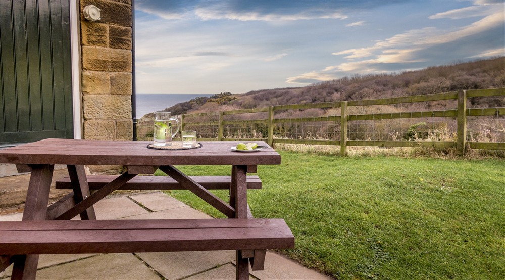 The picnic table in the garden at Low Peak in Ravenscar, North Yorkshire