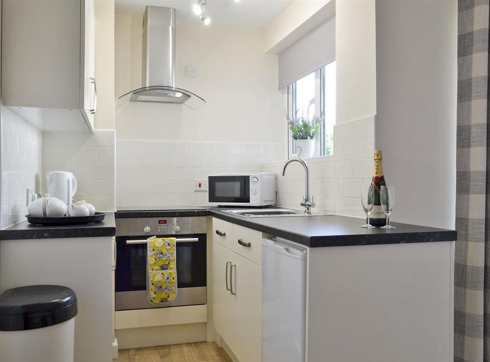 Well-equipped fitted kitchen at Low Rigg in Bowness-on-Windermere, Cumbria